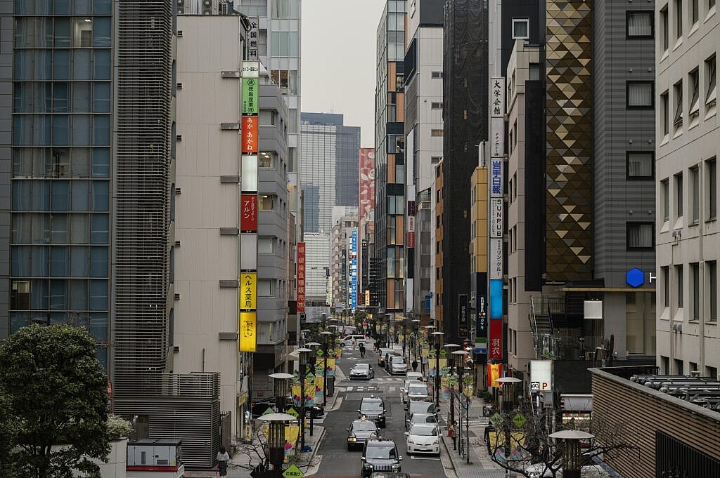 cars driving japan street