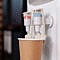 close up disposable cup water cooler startup office water dispenser with hot cold faucet used refreshment beverage space purified mineral water gallon 1