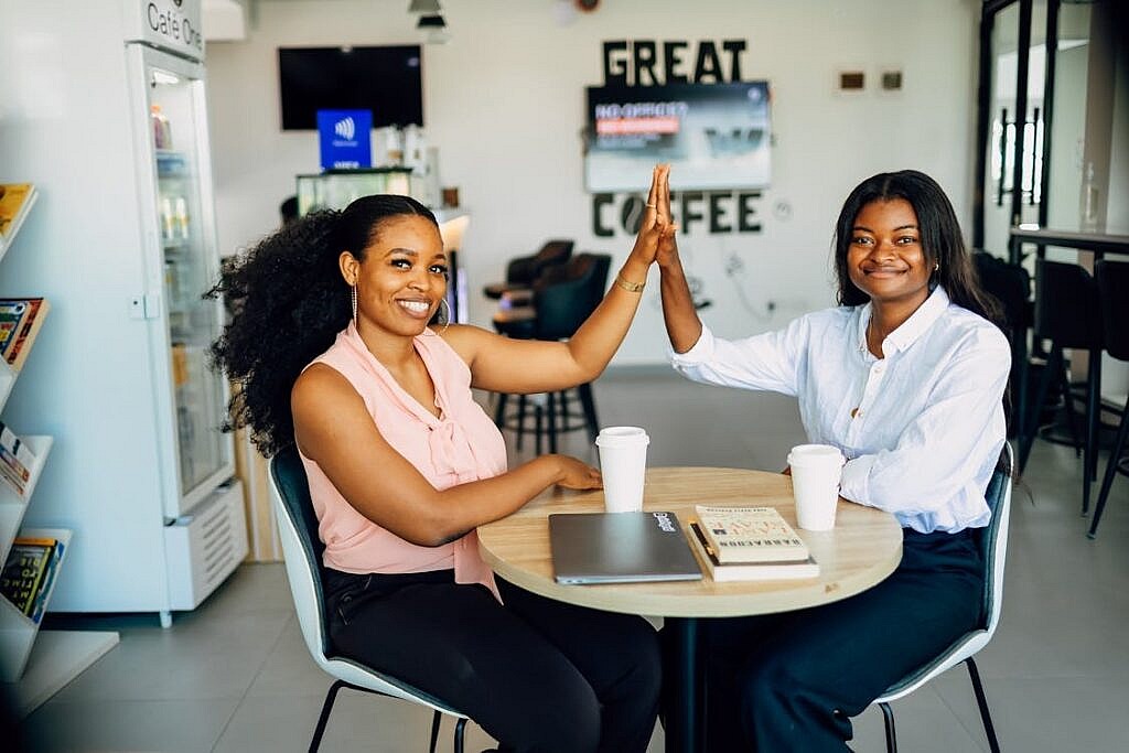 free photo of two women celebrat